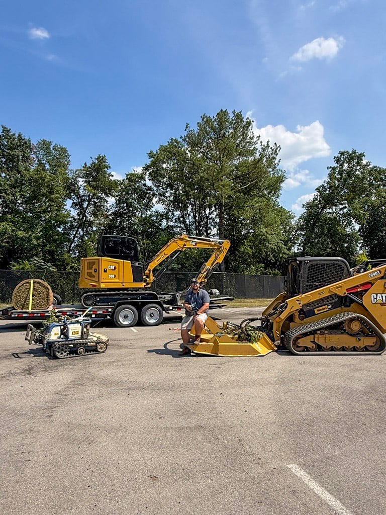 ClearSlope equipment lineup with a remote-controlled mower, mini excavator and tracked skid steer